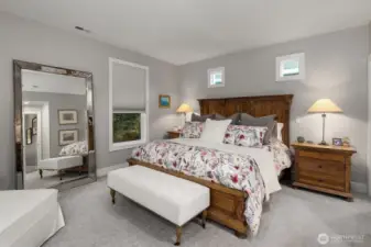 Luxurious primary space is spacious, yet cozy feeling