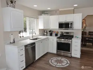 Light and Bright Kitchen w/ Stainless Steel Appliances.