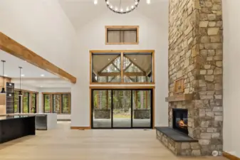 Great room with floor to ceiling stone fireplace.