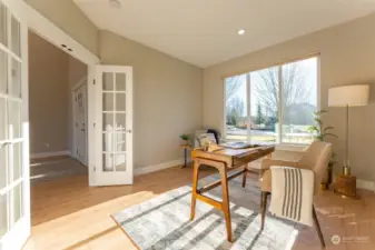 French doors accent the spacious office space located near the front entry.