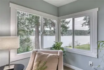 Living room with beautiful views out of all the windows.