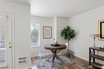 Dining nook with natural light flooding into this wonderful Ballard unit.