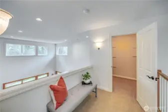 Gracious landing at top of the stairway overlooks the great room and foyer.