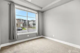 A bright, cheerful office showcasing a spacious window.