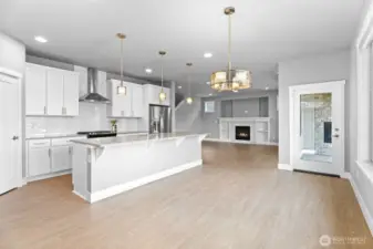 Ample dining space, with massive kitchen island and breakfast nook looking out on to the beautiful Tehaleh trails.