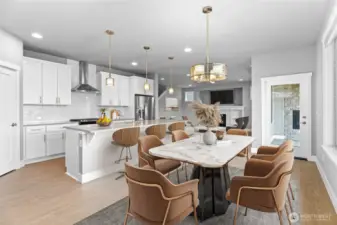 Ample dining space, with massive kitchen island and breakfast nook looking out on to the beautiful Tehaleh trails.