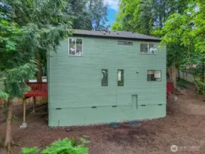 Back of house. bottom door leads to storage space the length of the house