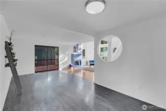 Dining room to living room and slider.