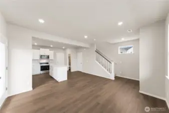 View from the heart of the kitchen into the bright and inviting great room—designed for easy everyday living.  Pictures are for representational purposes only, colors and features may vary.