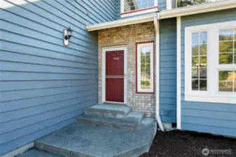 Brick framed front door invites you in to your beautiful new home.