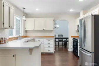 Formal dining area through the open doorway makes serving dinners a breeze.