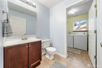 Large 1st floor guest bath and laundry room just through the doorway.