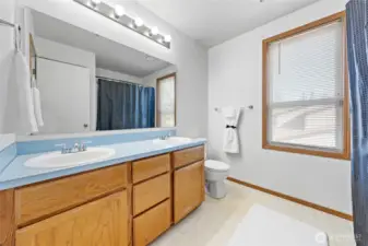 Dual sink makes getting ready in the morning stress free. Large linen closet located just behind the doorway adds additional function to this room.