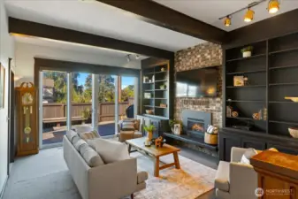 Living room off the kitchen that opens to the back deck