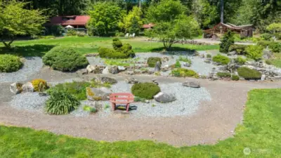 Rock garden with waterfall pond is only one of the focal points.
