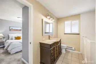 Elegant vanity alongside an ADA bathtub.