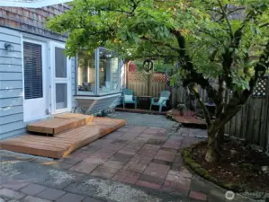 Patio with additional seating and fountain.