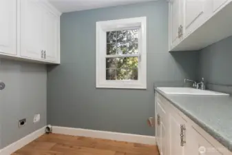 Utility room is located downstairs with a laundry shoot from the upstairs.