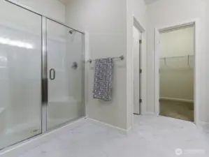 Primary has separate toilet area.  Nice sized shower with glass shower doors was upgrade.