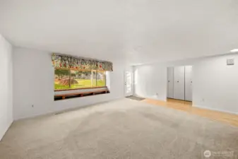 Living room looking towards the front entrance and hallway to bedrooms.