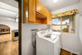 Laundry room is situated between the kitchen & the garage.