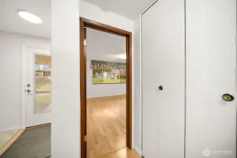 Front entrance to the left and primary bedroom to the right.