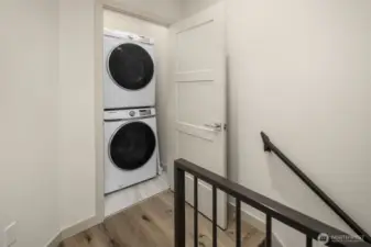 Full size washer/dryer on second level.