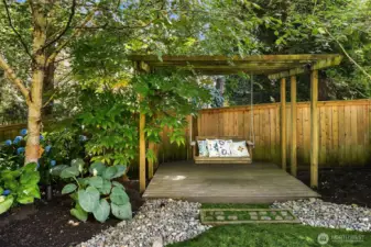 Backyard trellis with swing