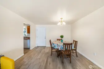Dining area with access to backyard and kitchen.