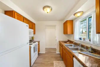 Bright kitchen includes all appliances.