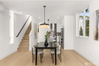 Seamless transitions between levels with contemporary fixtures and wide-plank flooring throughout.