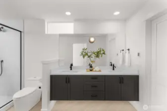 Sophisticated primary bath with a double vanity, modern cabinetry, and high-end tile work.
