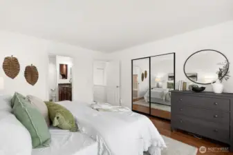 Primary bedroom, there is a walk in closet behind those mirrored doors