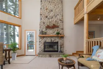 Beautiful built ins and detailing in this treasure of a home. Massive river rock fireplace is so handsome!