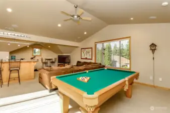T he game room!! Includes pool table, wet bar, and exercise area. Great for entertaining!