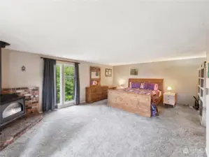 Extremely spacious private primary bedroom with gas fireplace.
