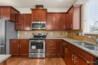 Granite countertops throughout gourmet kitchen.