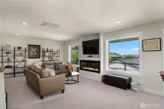 Upstairs family room with views of Puget Sound and Olympics.  Deck and the wet bar make will make this your favorite space.