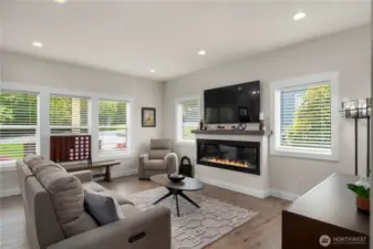 Light and bright entry with electric fireplace. Tons of windows for northwest days.