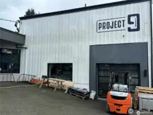 Dangerously close, Project 9 is a true neighbor, three doors away across the alley. New fun brew pub with sunny patio, food trucks, and a great vib