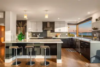 Large living area with bar to cook and eat together.