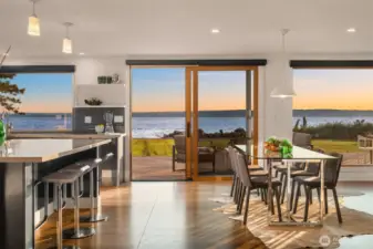 Easy entertaining space with dining next to kitchen all while soaking in the views of the Sound.