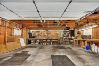 Huge detached 2 car garage with work bench and storage in the rafters