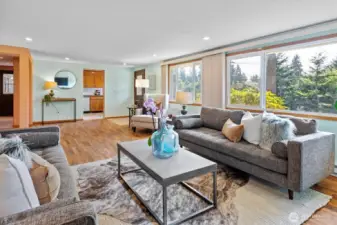 The living room is just amazing, mid-century modern proportions, recessed ceiling lights, big west-facing windows . . .