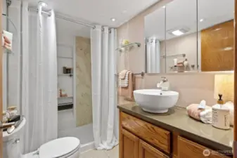 This 3/4 bath has secret storage underneath the towel rack!