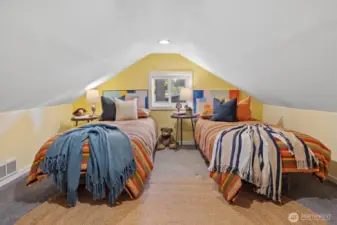 This upstairs bonus room is low-ceilinged, but can also be used for storage . . .