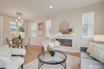 Photos of the staged model home with the same floorplan and similar finishes.