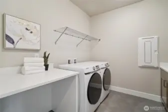 Photos of the staged model home with the same floorplan and similar finishes.