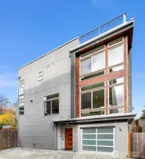 Spacious home with attached garage and multiple outdoor spaces.