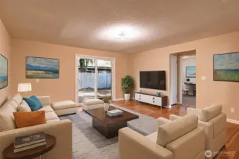 The living room is a nice size with sliders to outside.